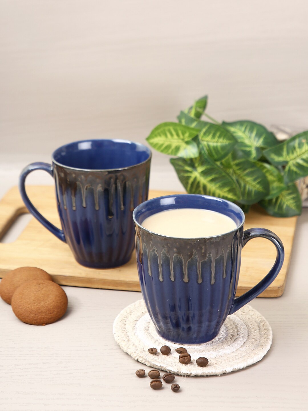 

Aapno Rajasthan Set Of 4 Navy Blue Textured Ceramic Glossy Mugs