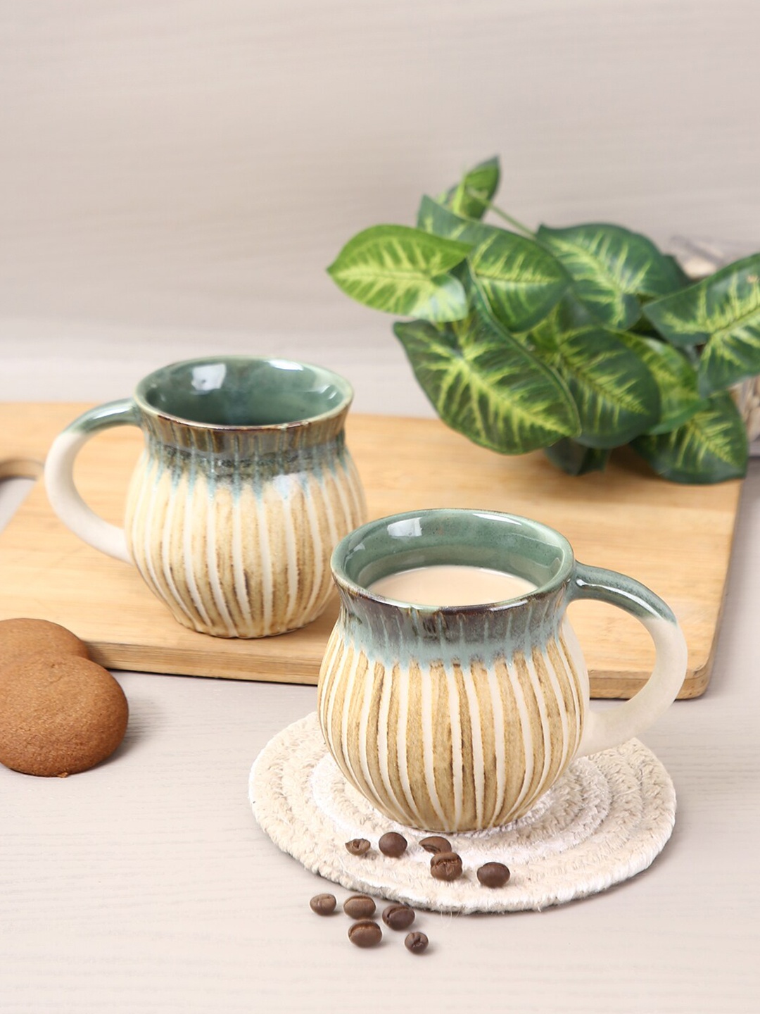 

Aapno Rajasthan Set Of 2 Beige & Green Textured Ceramic Glossy Mugs