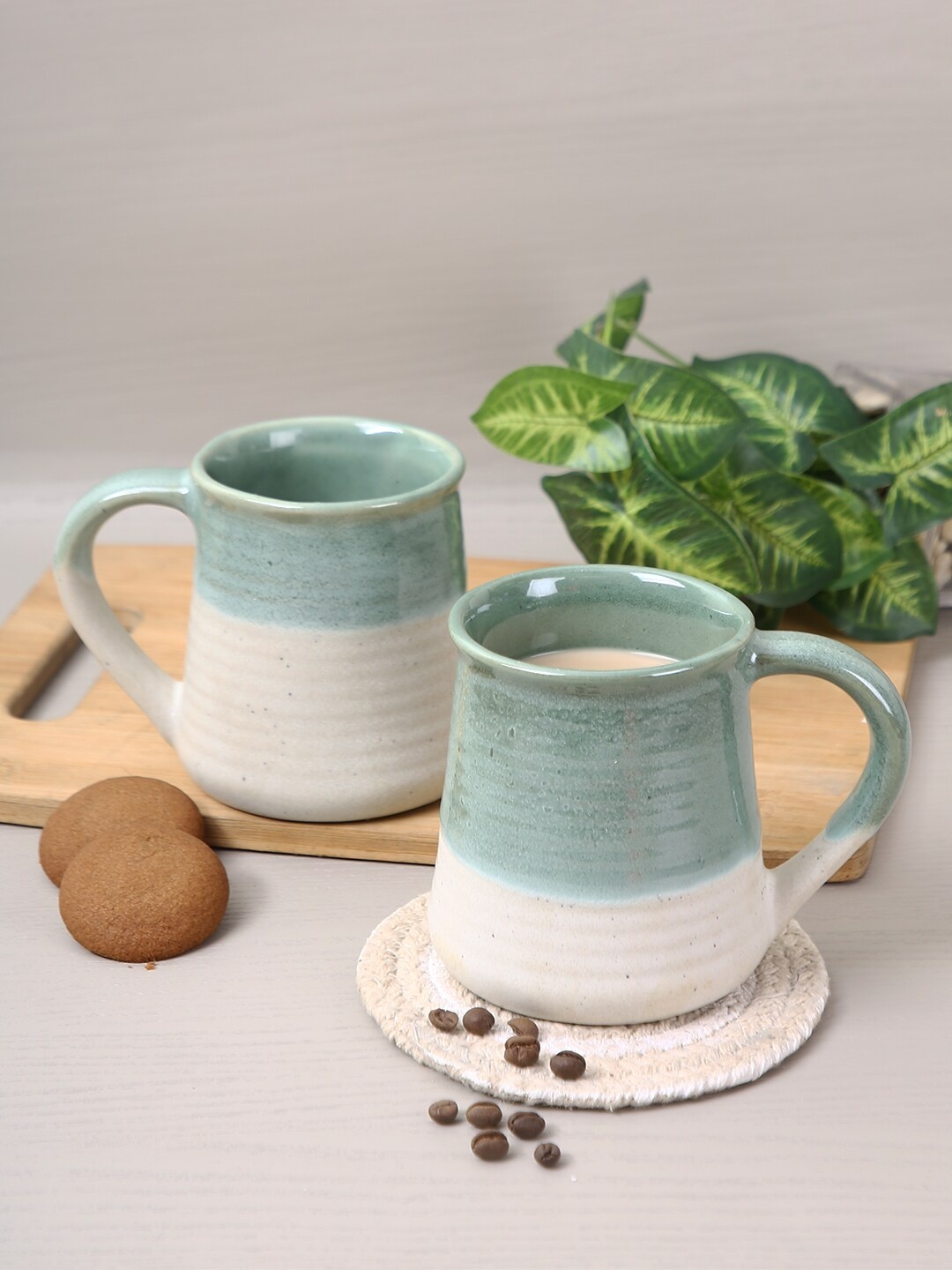 

Aapno Rajasthan Set Of 4 Turquoise Blue & Off White Textured Ceramic Glossy Mugs
