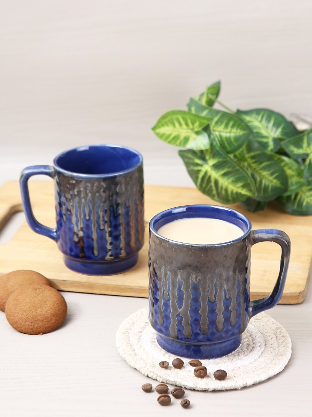 

Aapno Rajasthan Set Of 4 Navy Blue Textured Ceramic Glossy Coffee Mugs