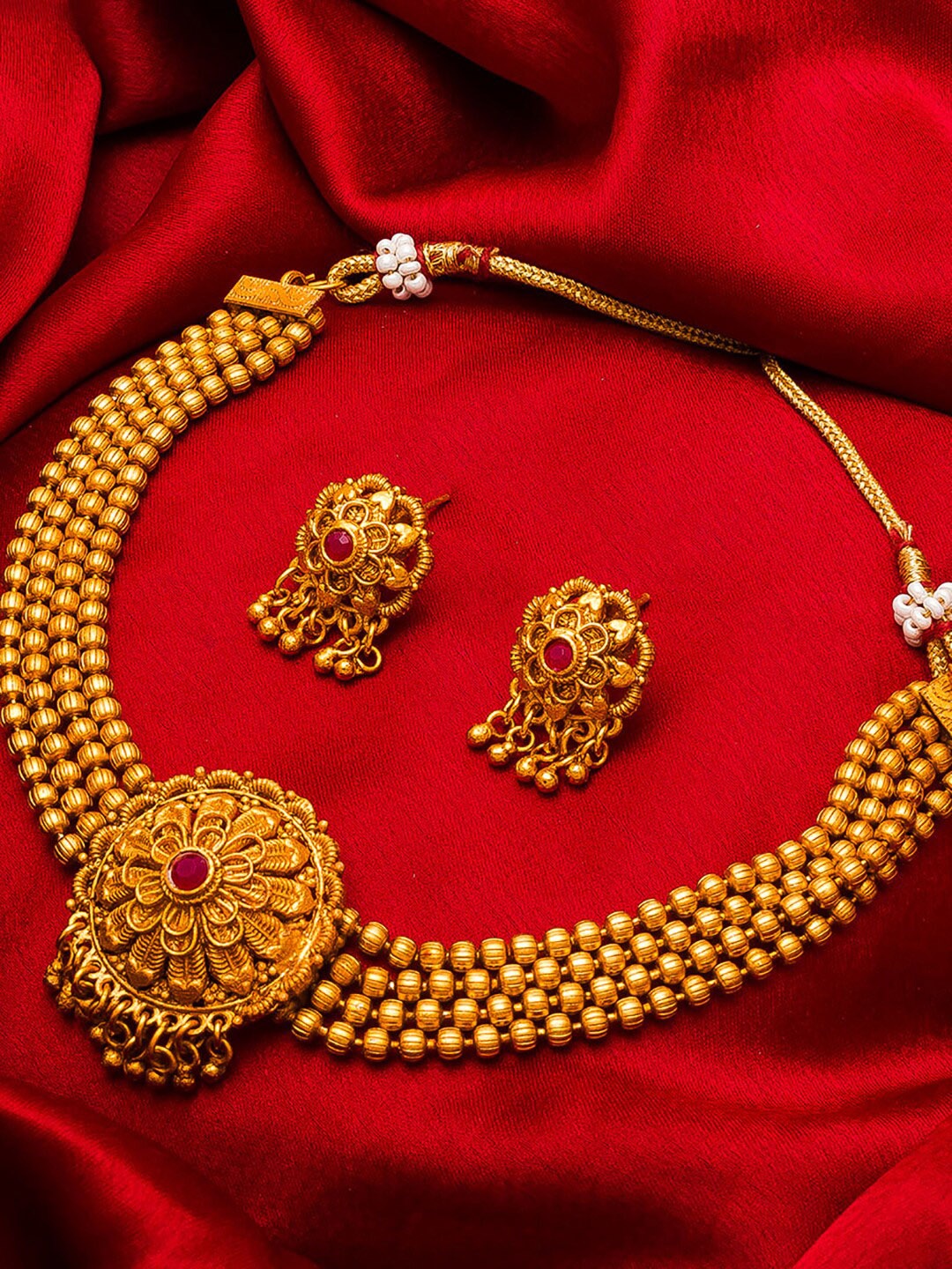 

aadita Gold-Plated Pink Stone-Studded Temple Jewellery Set