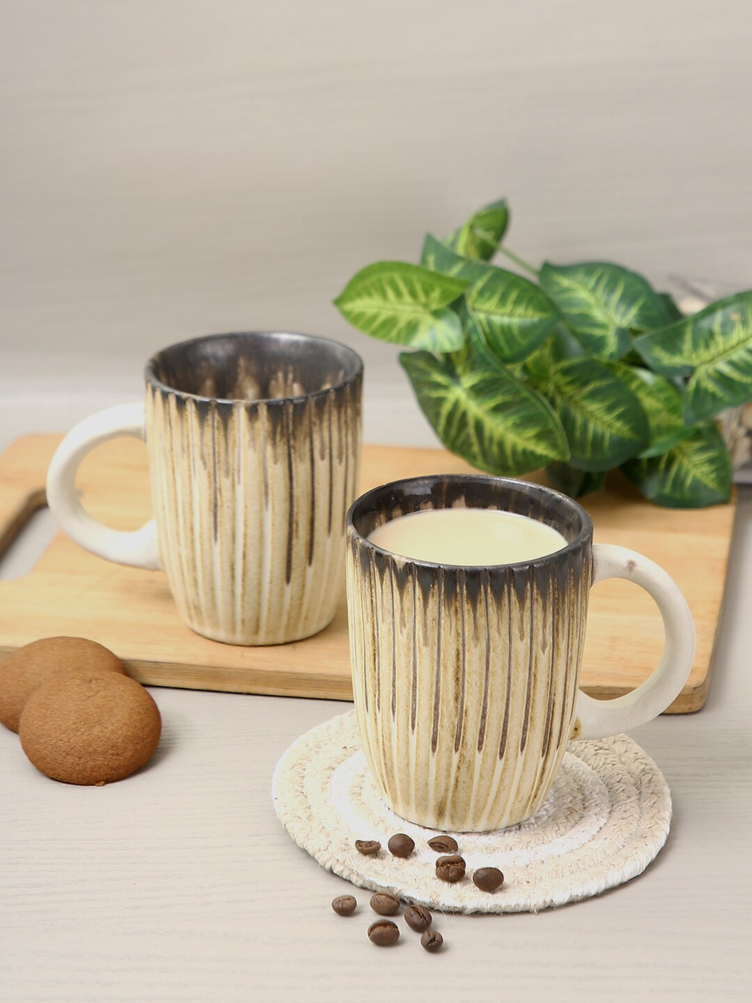 

Aapno Rajasthan Set Of 4 Beige Textured Ceramic Glossy Mugs