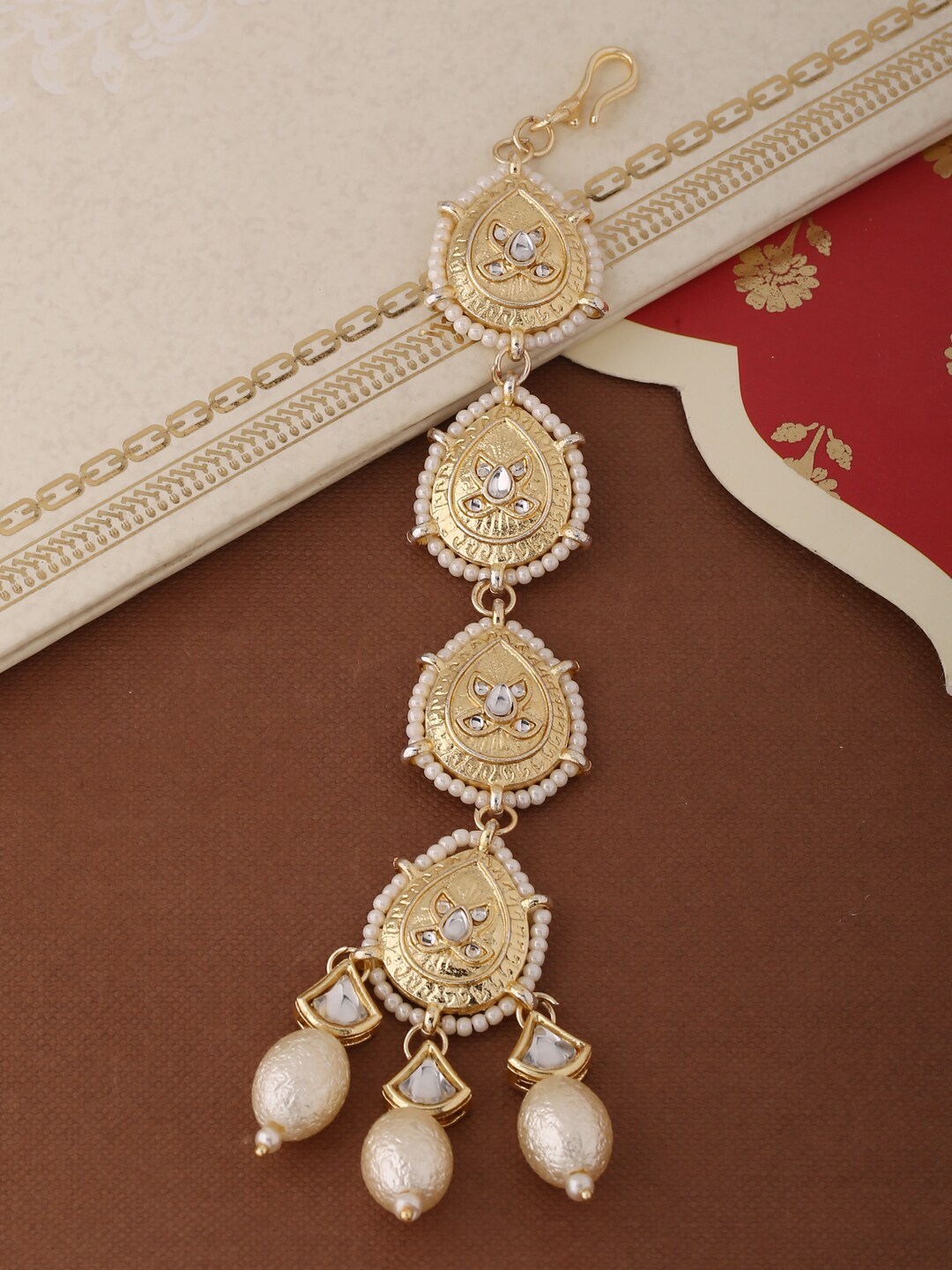 

Shoshaa Gold-Plated & White Stone-Studded & Beaded Handcrafted Maang Tikka