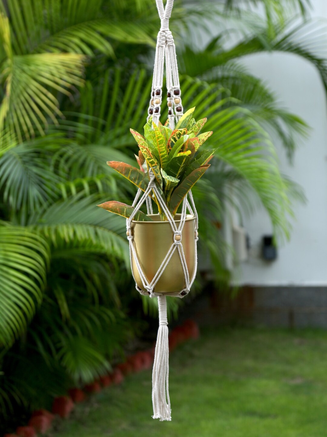 

Amoliconcepts Off White & Red Handcrafted Macrame Hanging Planter With Wooden Beads