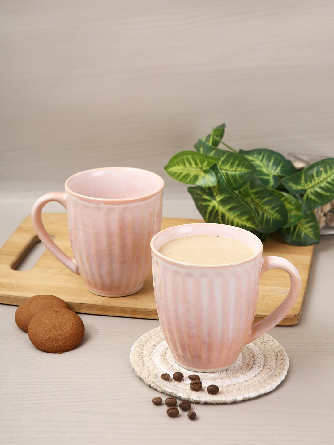 

Aapno Rajasthan Set Of 4 Pink Textured Ceramic Glossy Mugs