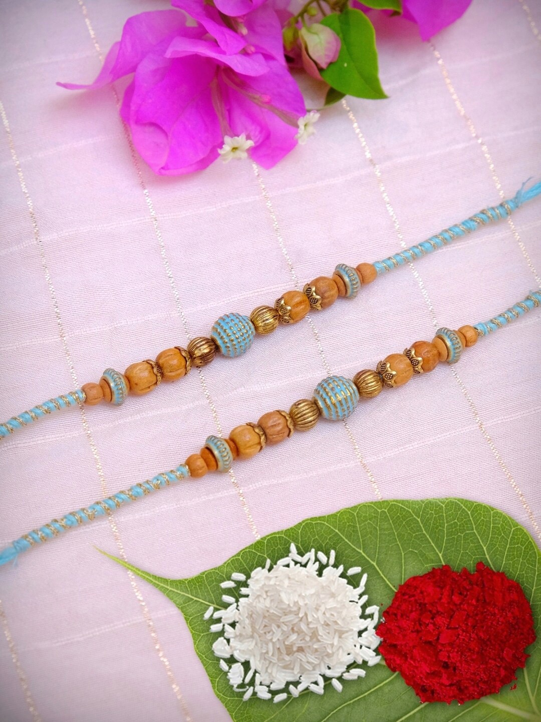 

Crunchy Fashion Set Of 2 Grey & Brown Rakhi With Roli Chawal Tilak