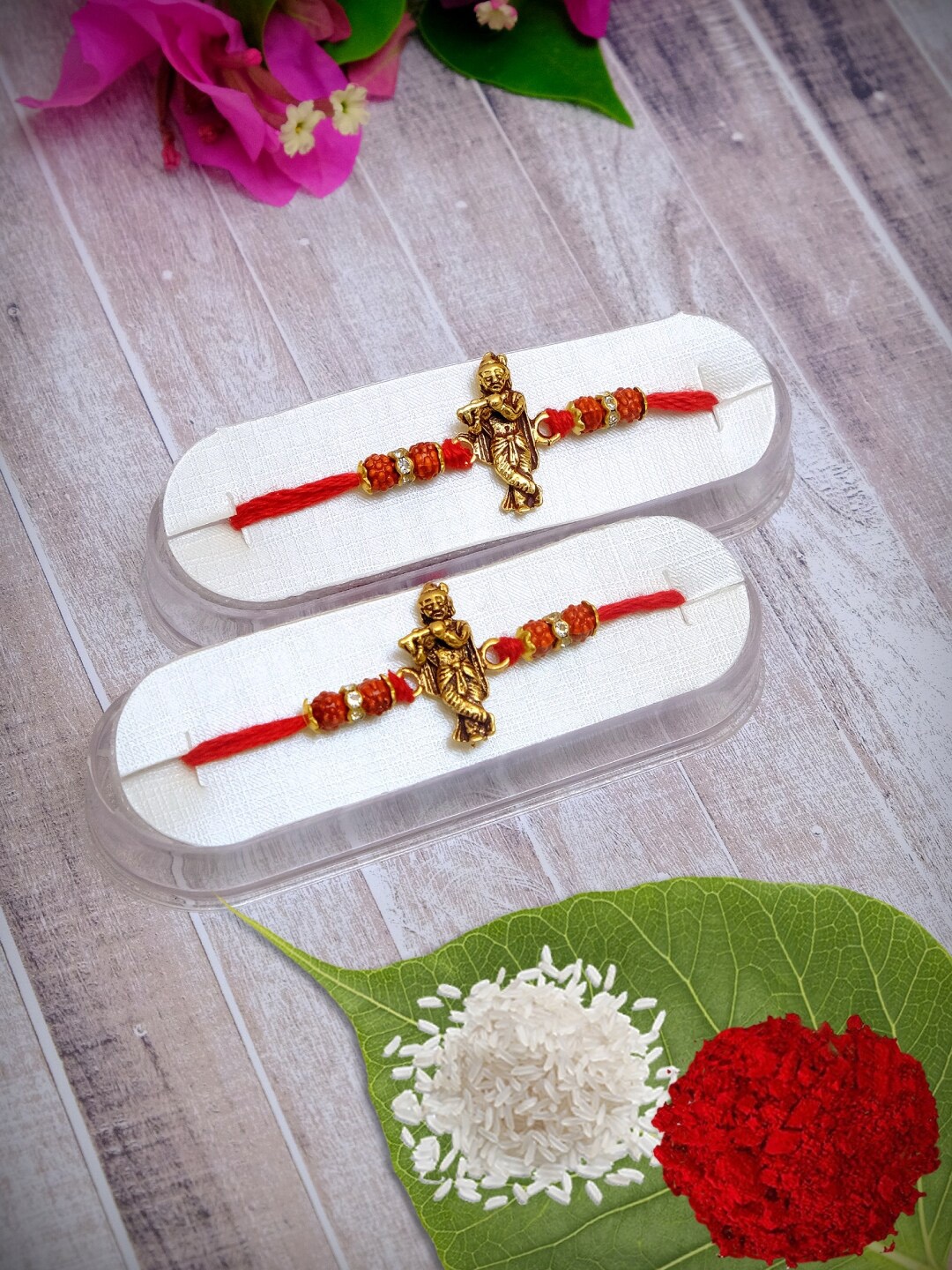 

Crunchy Fashion Set Of 2 Red & Gold-Toned Shri Krishna Sutra Rakhis With Roli Chawal Tilak