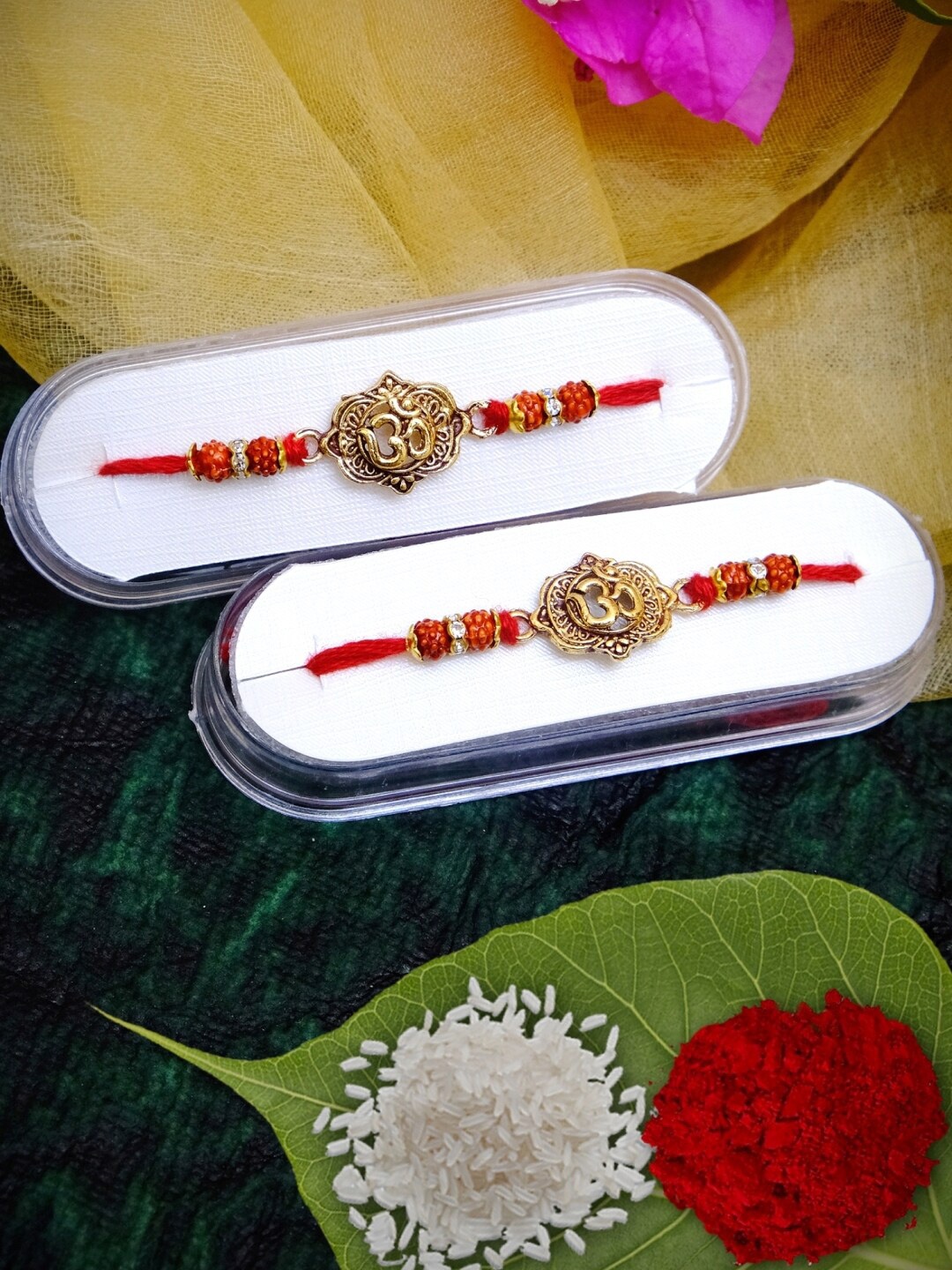 

Crunchy Fashion Pack of 2 Gold Plated Om Fancy Rakhi