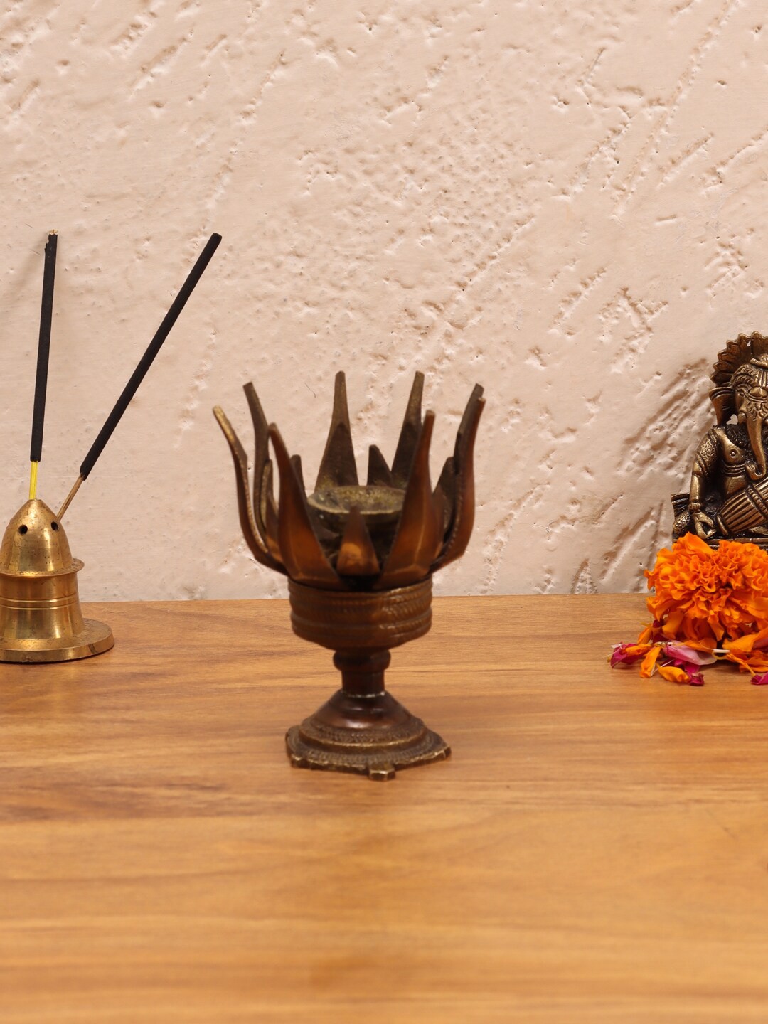 

Aapno Rajasthan Brown Lotus Oil Lamp Showpiece