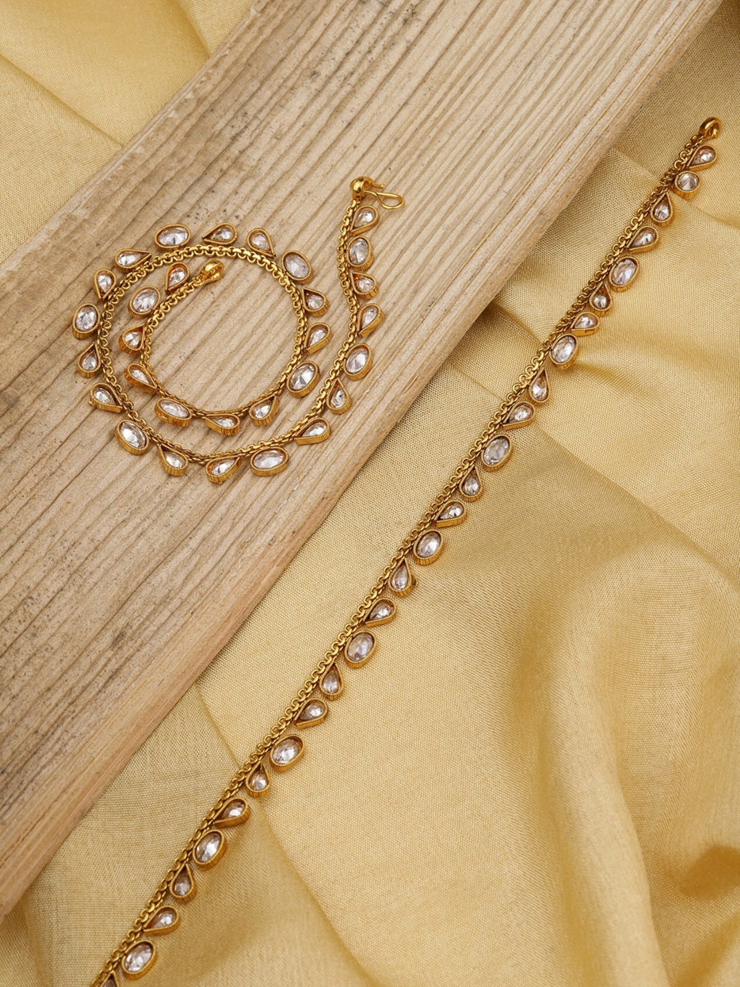 

Priyaasi Set Of 2 Gold-Plated White Stone-Studded Handcrafted Anklets