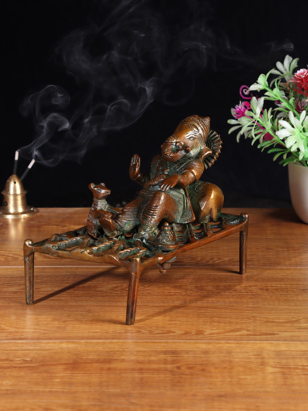 

Aapno Rajasthan Brown Resting Ganesha Brass Showpiece