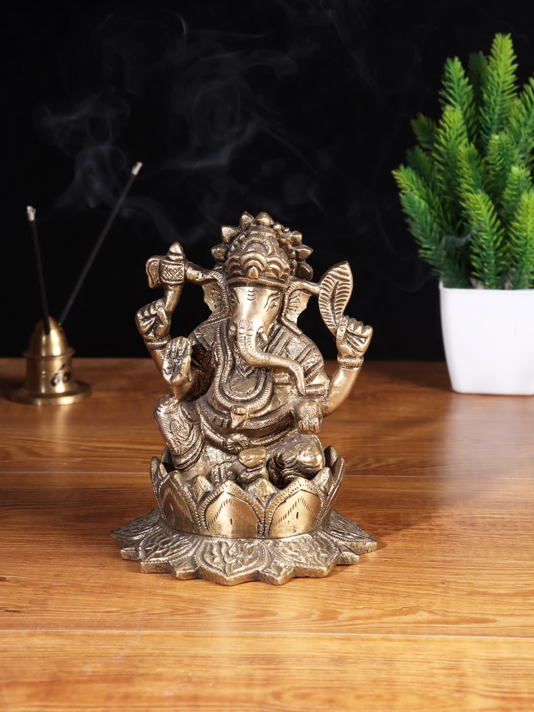 

Aapno Rajasthan Brown Ganesha On Lotus Brass Showpiece