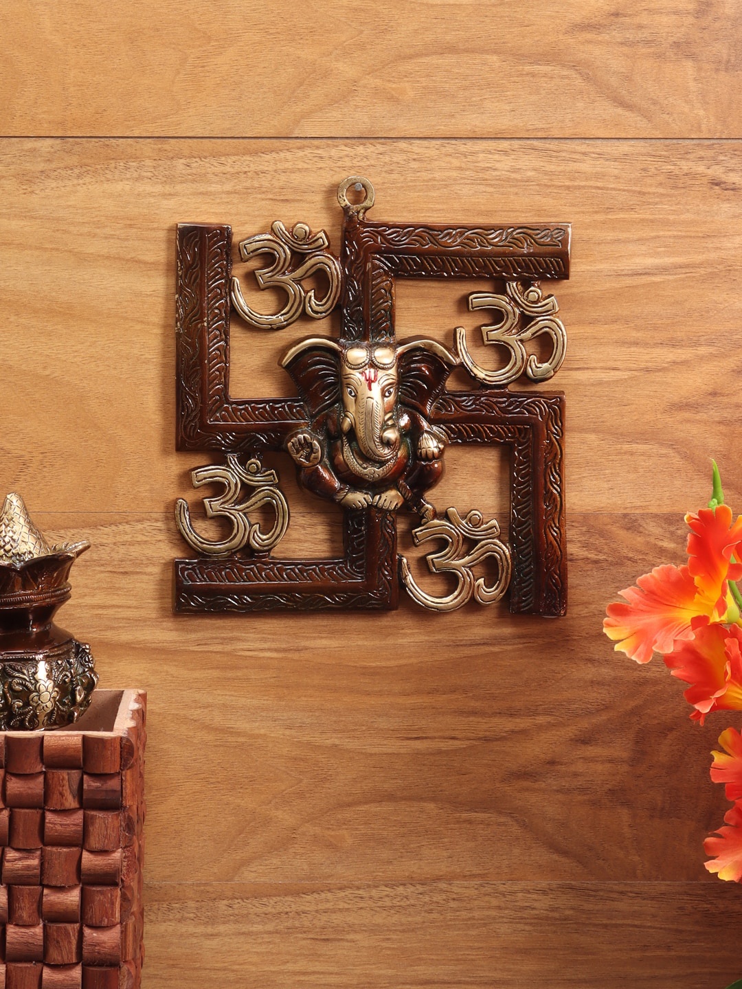 

Aapno Rajasthan Brown Ganesha On Swastika Wall Hanging