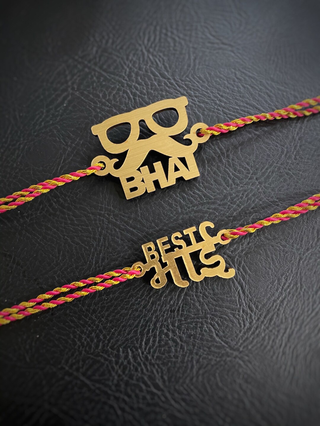 

Digital Dress Room Men Set of 2 Gold Slogan Rakhi