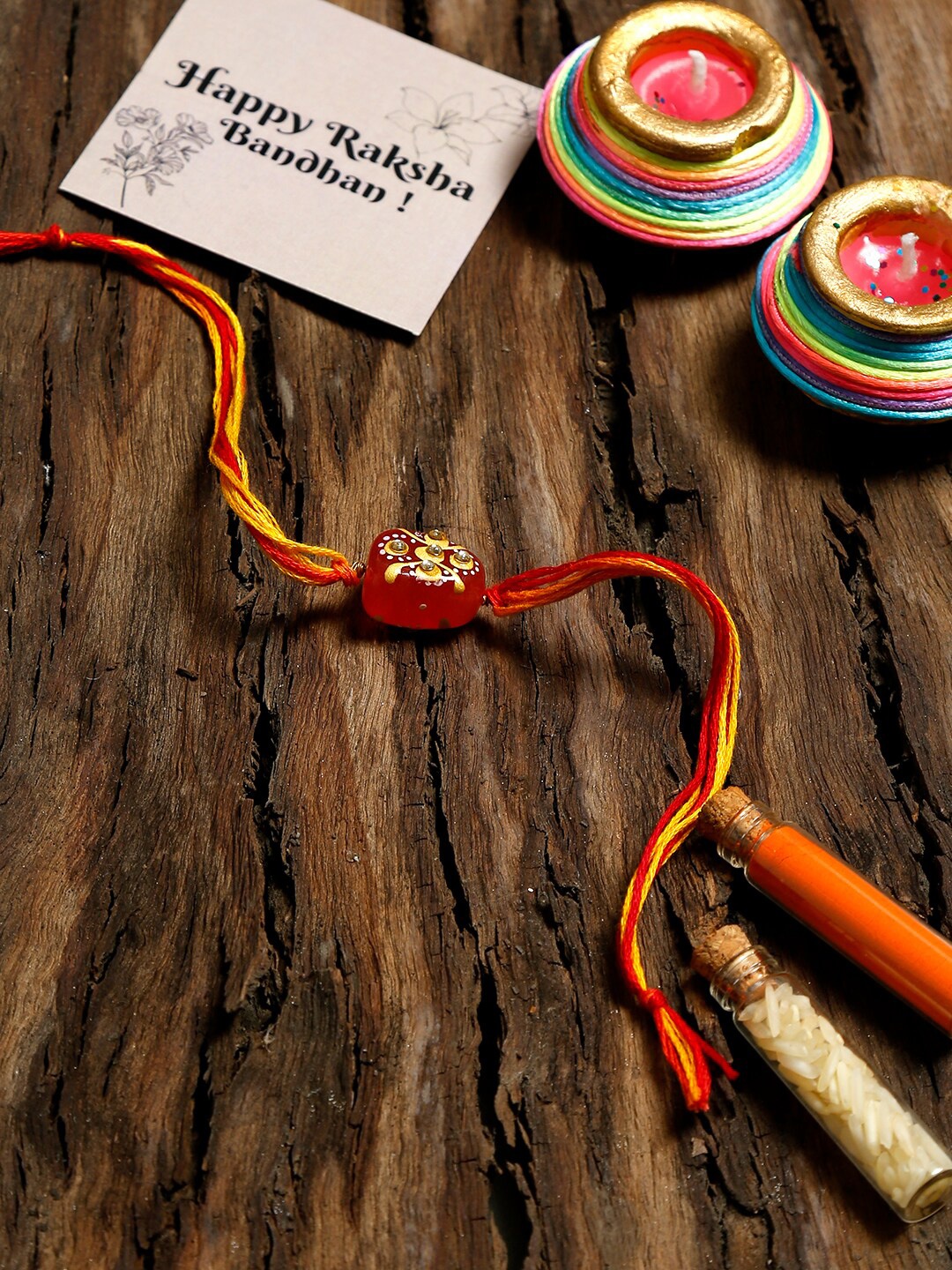 

Ruby Raang Red & Gold Kundan Rakhi Gift Box with Rice & Vermilion