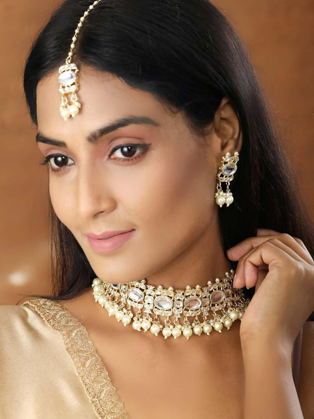 

Priyaasi Gold-Plated White Kundan-Studded & Pearl Beaded Handcrafted Jewellery Set