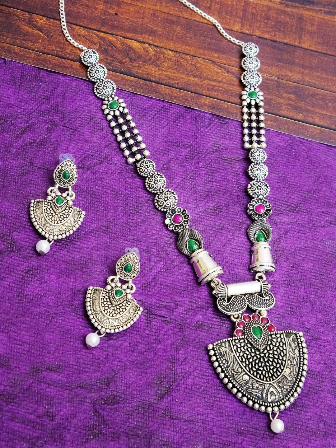 

Crunchy Fashion Oxidised Silver-Plated Green & Red Stone-Studded & White Beaded Antique Jewellery Set