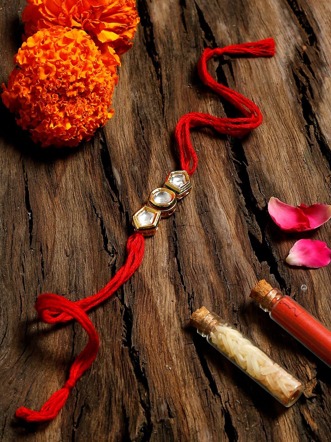 

Ruby Raang Red & Gold-Toned Handcrafted Kundan Rakhi Gift Box
