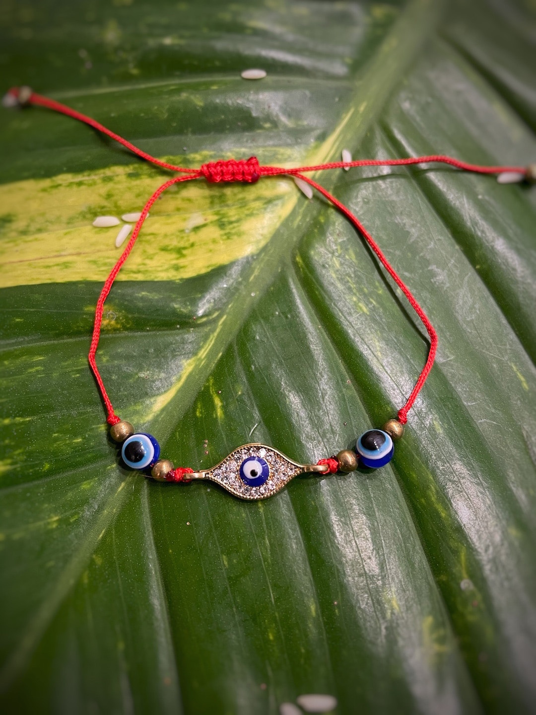 

Digital Dress Room Red & Blue CZ Pendant Evil Eye Turkish Charm Rakhi