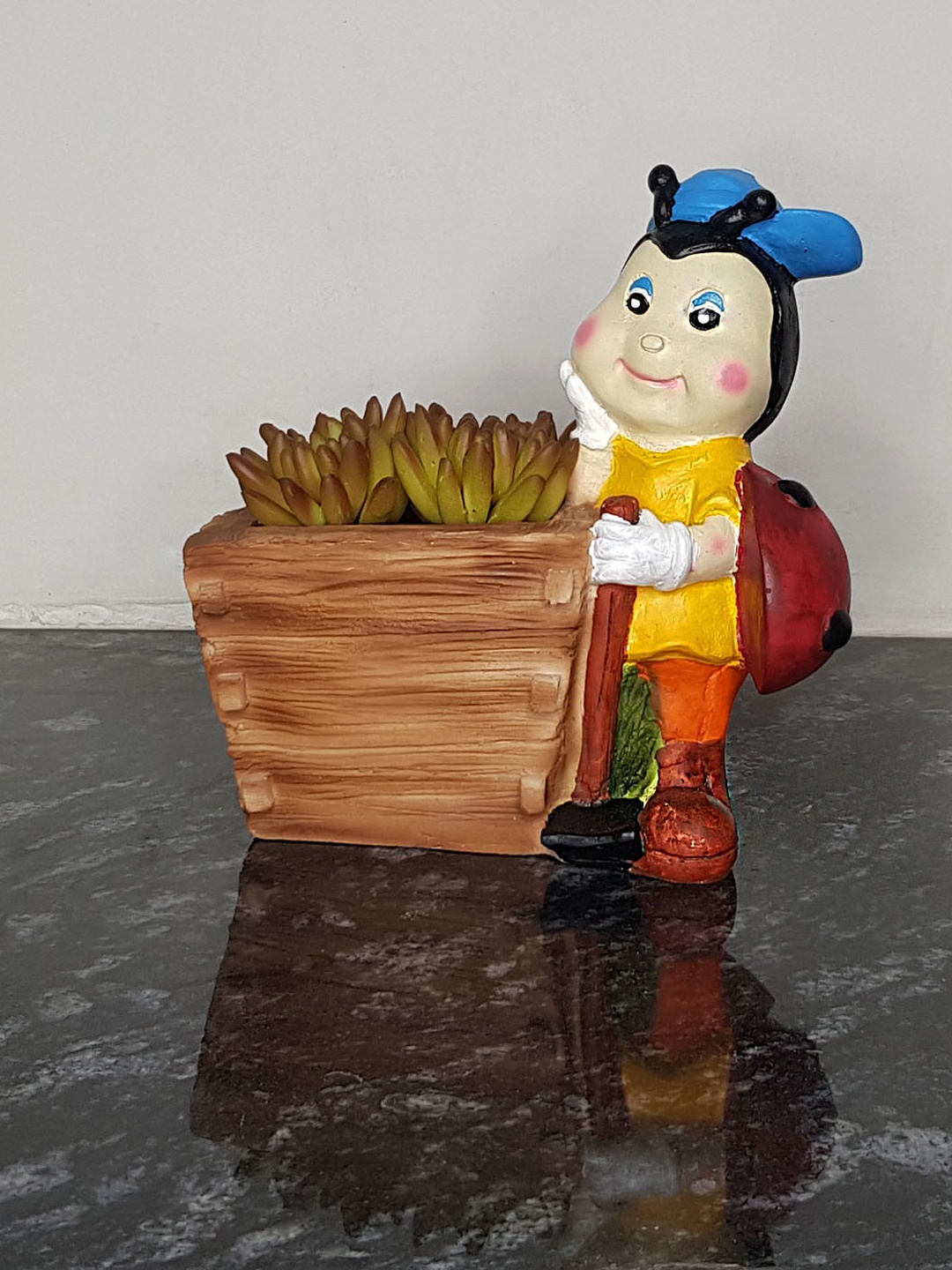 

Wonderland Brown & Yellow Gnome Girl Ladybird with Cap Holding Flower Planter