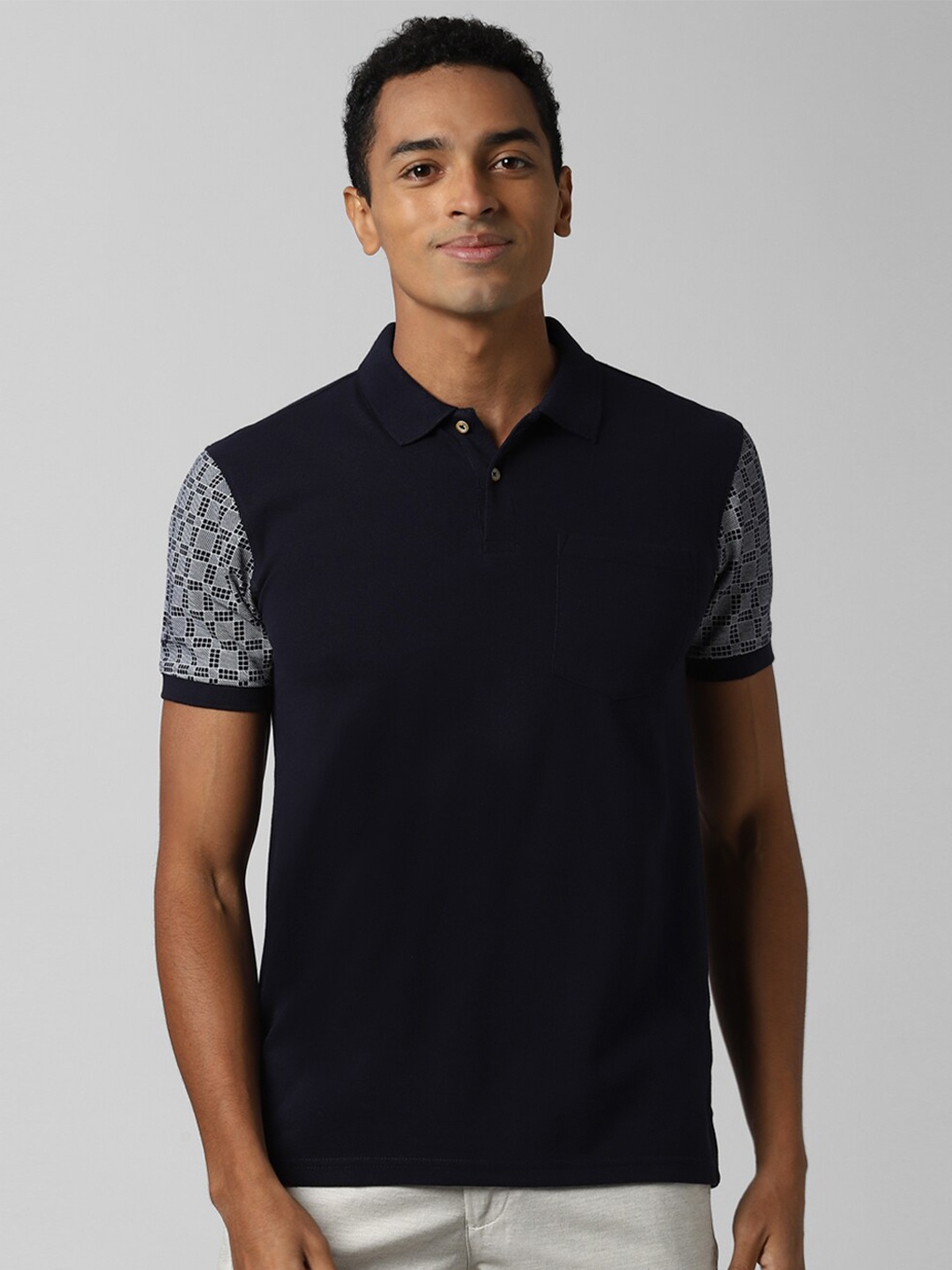

Peter England Casuals Men Navy Blue & Off White Polo Collar Slim Fit T-shirt