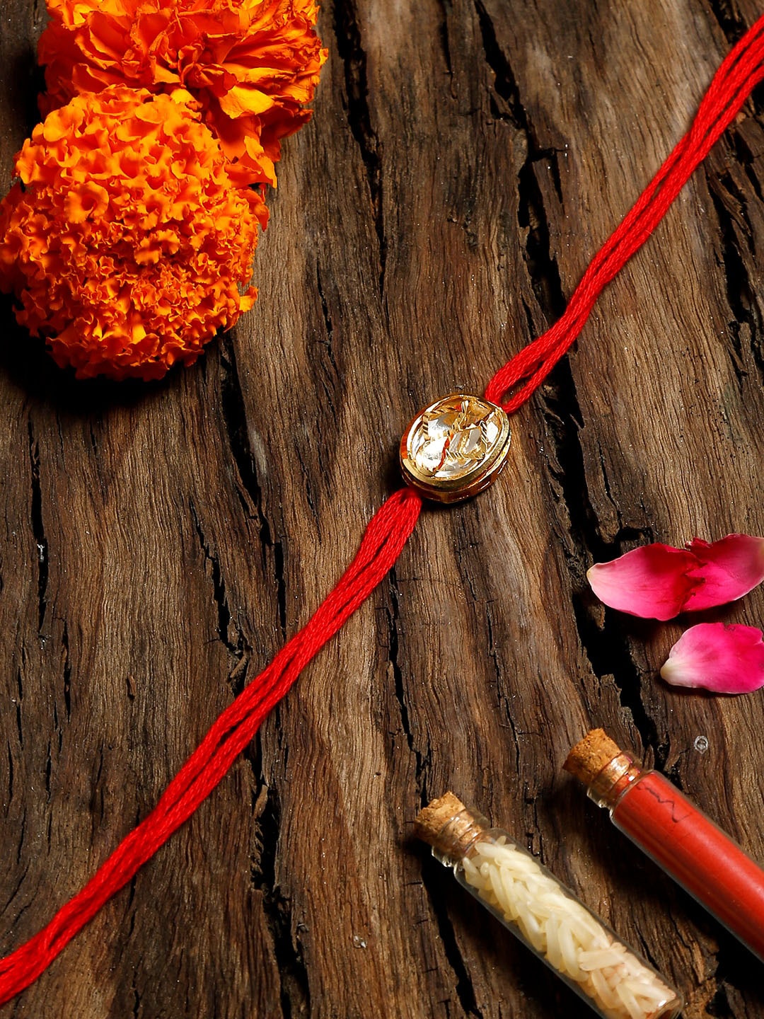 

Ruby Raang Red & Gold-Toned Kundan Rakhi Gift Box