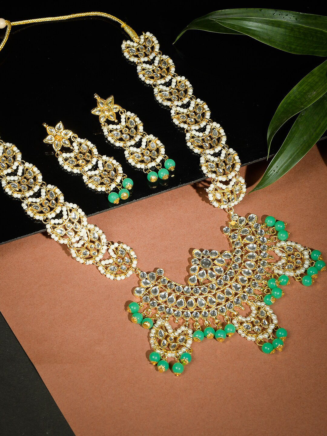 

Silvermerc Designs Gold-Plated Green & White Stone-Studded & Beaded Jadau Jewellery Set