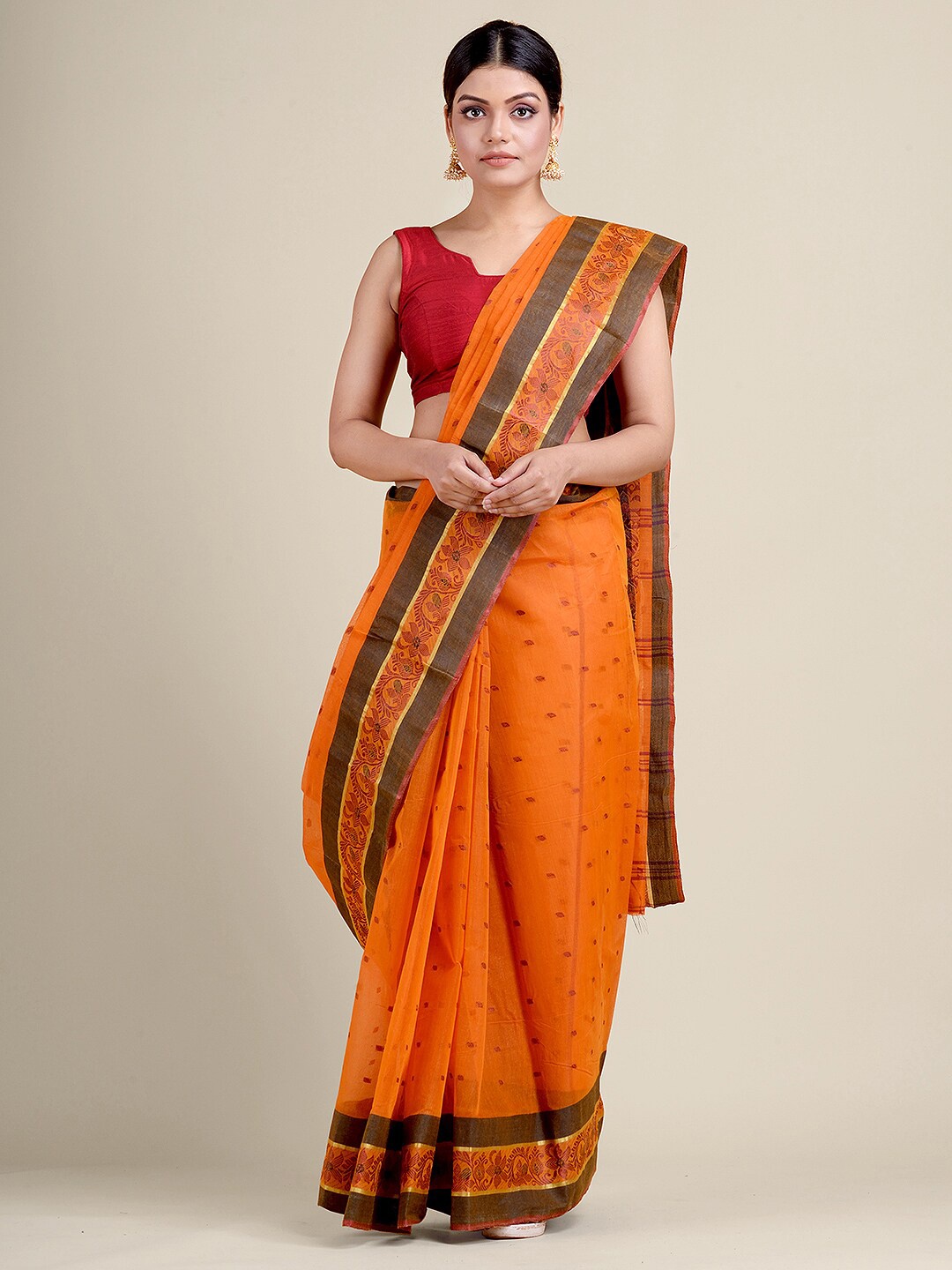 

Charukriti Orange Woven Design Zari Pure Cotton Taant Saree