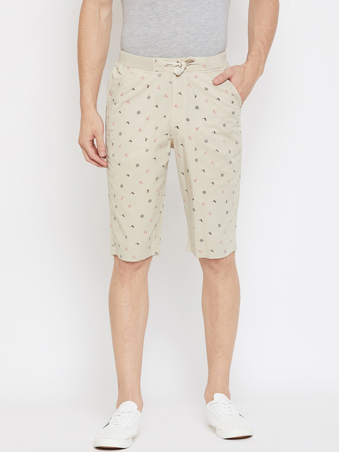 

Okane Men Beige Printed Mid-Rise Regular Shorts