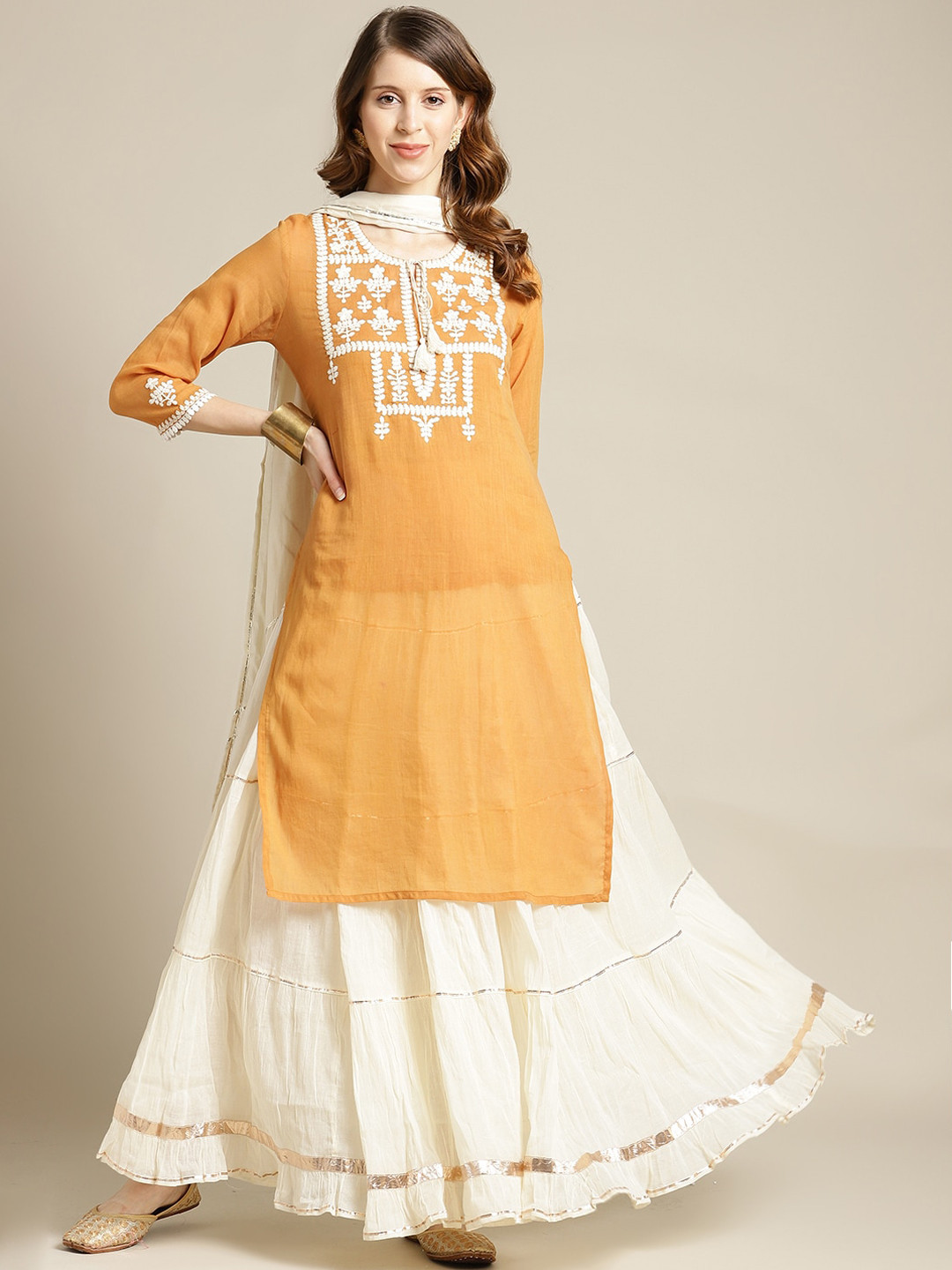 

Varanga Women Mustard Yellow Ethnic Motifs Yoke Design Thread Work Kurta with Skirt