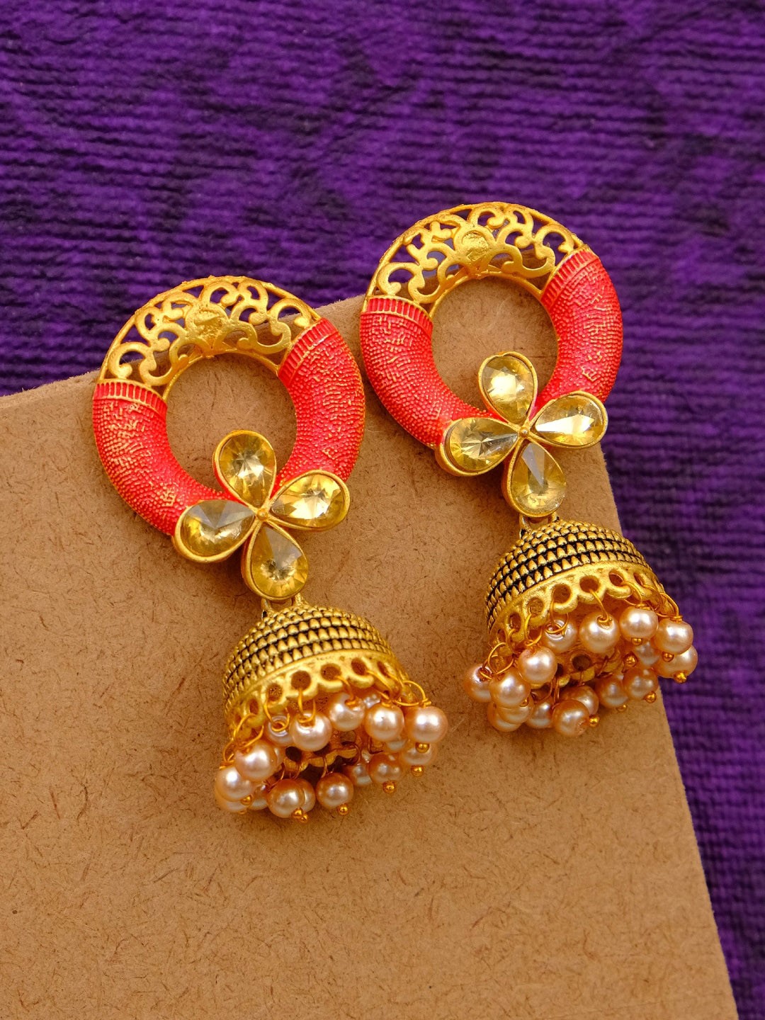 

Crunchy Fashion Women Gold-Toned & Coral Contemporary Kundan Style Jhumkas Earrings