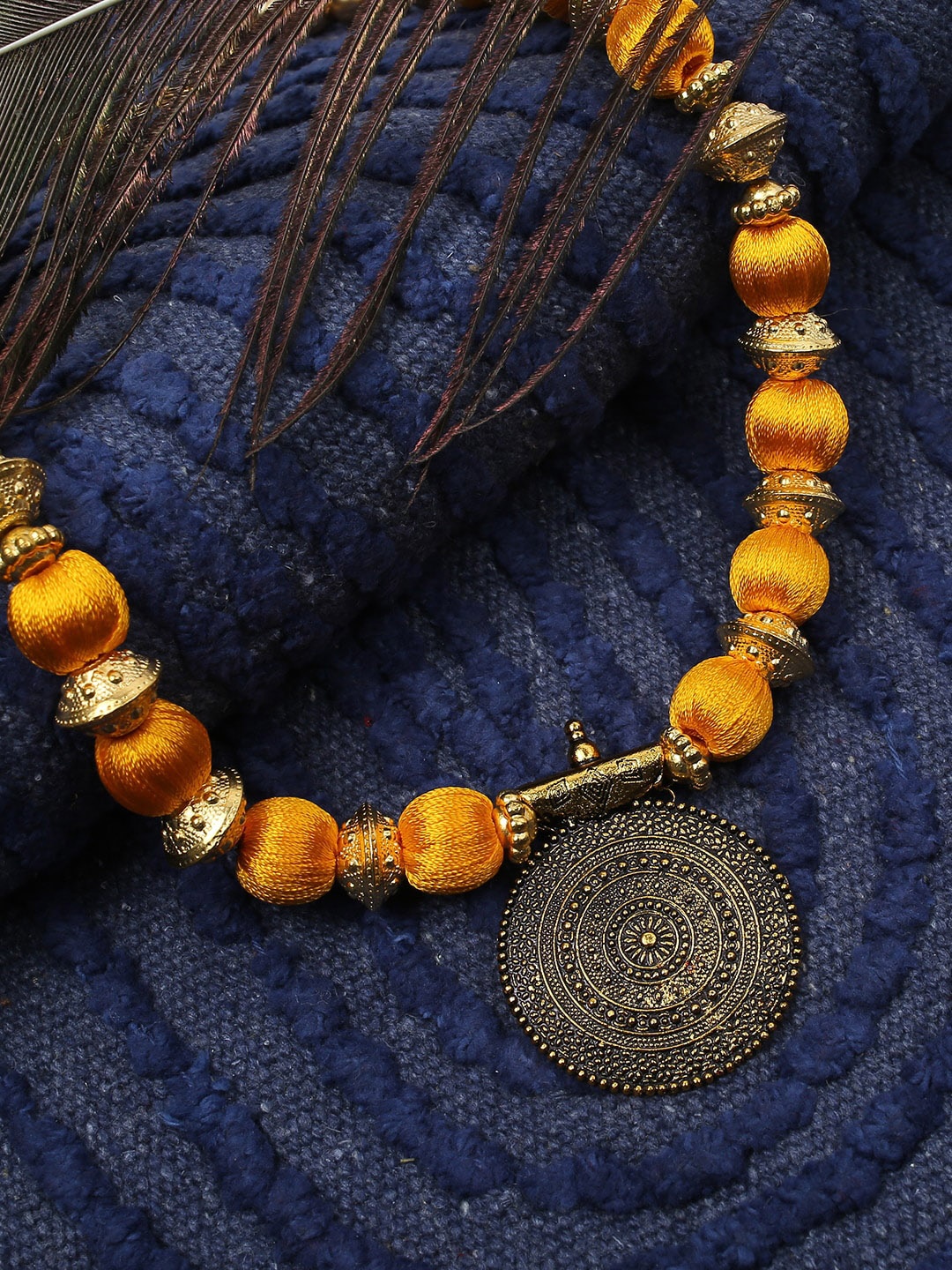 

Akshara Women Gold-Toned & Yellow Handcrafted Long Brass Pendent Necklace