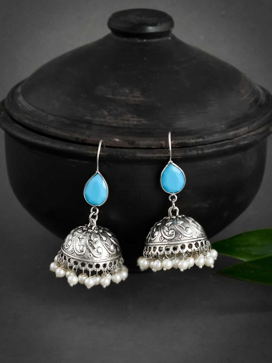 

Silvermerc Designs Silver-Toned & Blue Stone Studded Dome Shaped Jhumkas Earrings