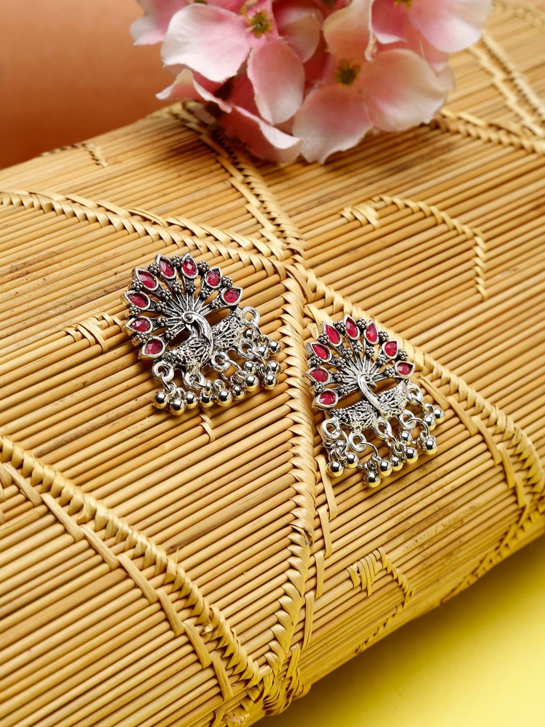 

NEUDIS Silver-Toned & Red Artificial Stone Studded Peacock Shaped Drop Earrings