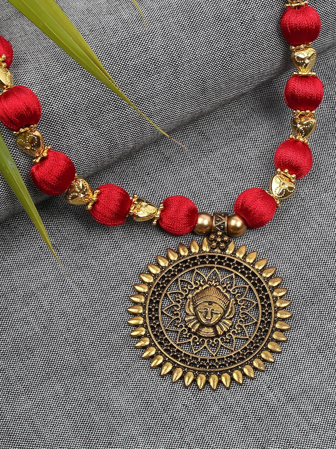 

AKSHARA Gold-Toned & Red Handcrafted Long Brass Pendent Necklace