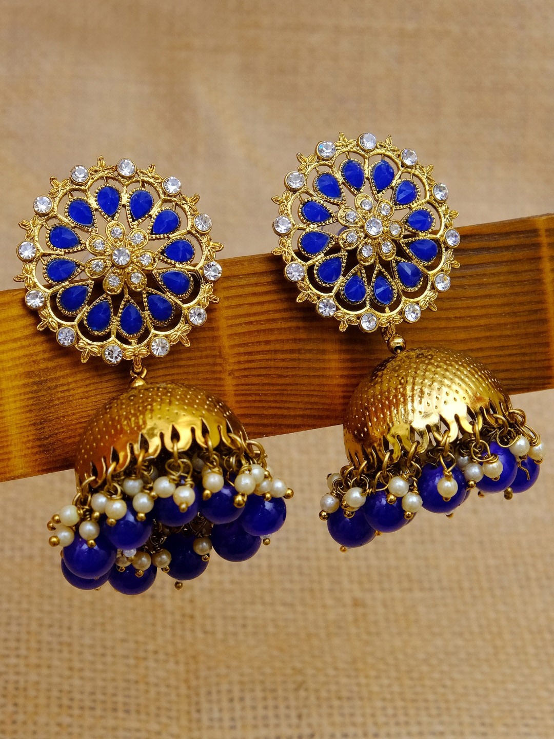 

Crunchy Fashion Gold-Toned & Blue stones & Beads Studded Dome Shaped Jhumkas Earrings