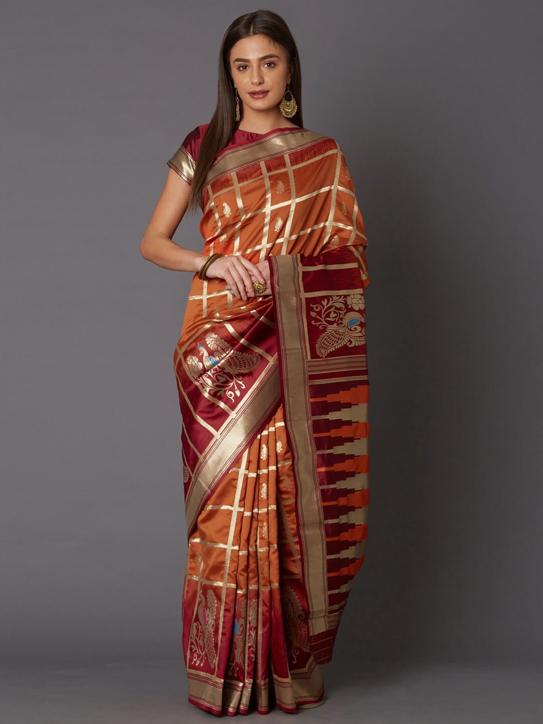 

Mitera Rust & Maroon Ethnic Motifs Zari Silk Blend Saree