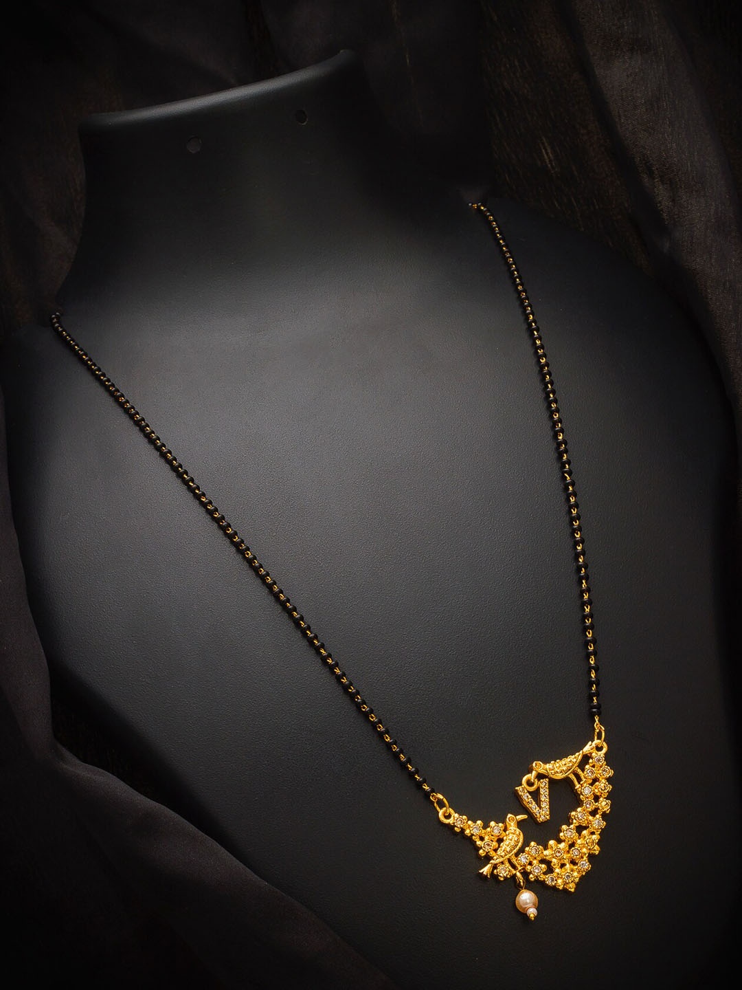 

aadita Gold-Plated Black & White Stone-Studded Alphabet Initials Letter V Mangalsutra