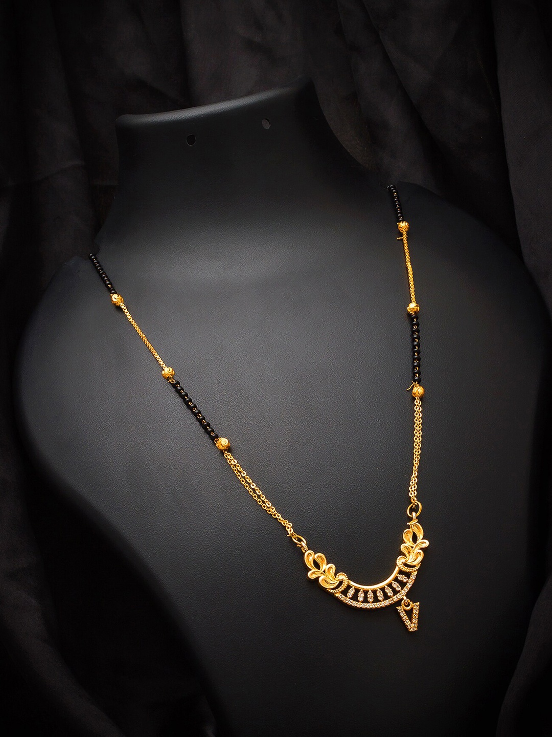 

aadita Gold-Plated Black Beaded & White AD-Studded Alphabet Initials Letter V Mangalsutra