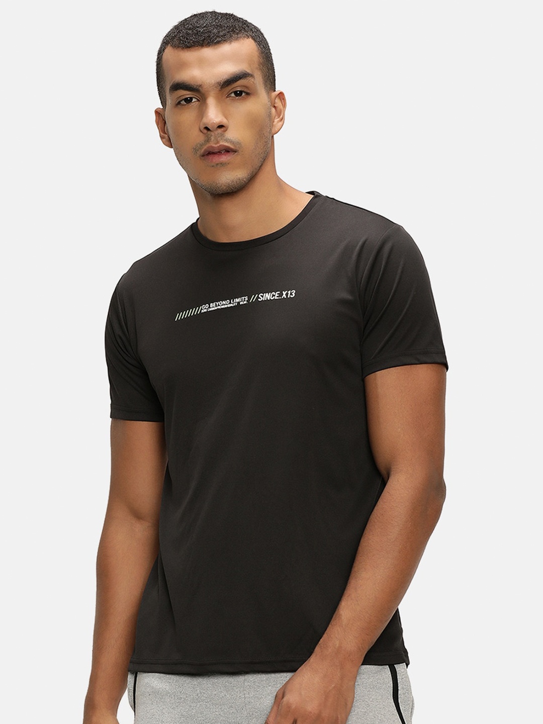 

V2 Value & Variety Men Black Solid T-shirt With Printed Detailing