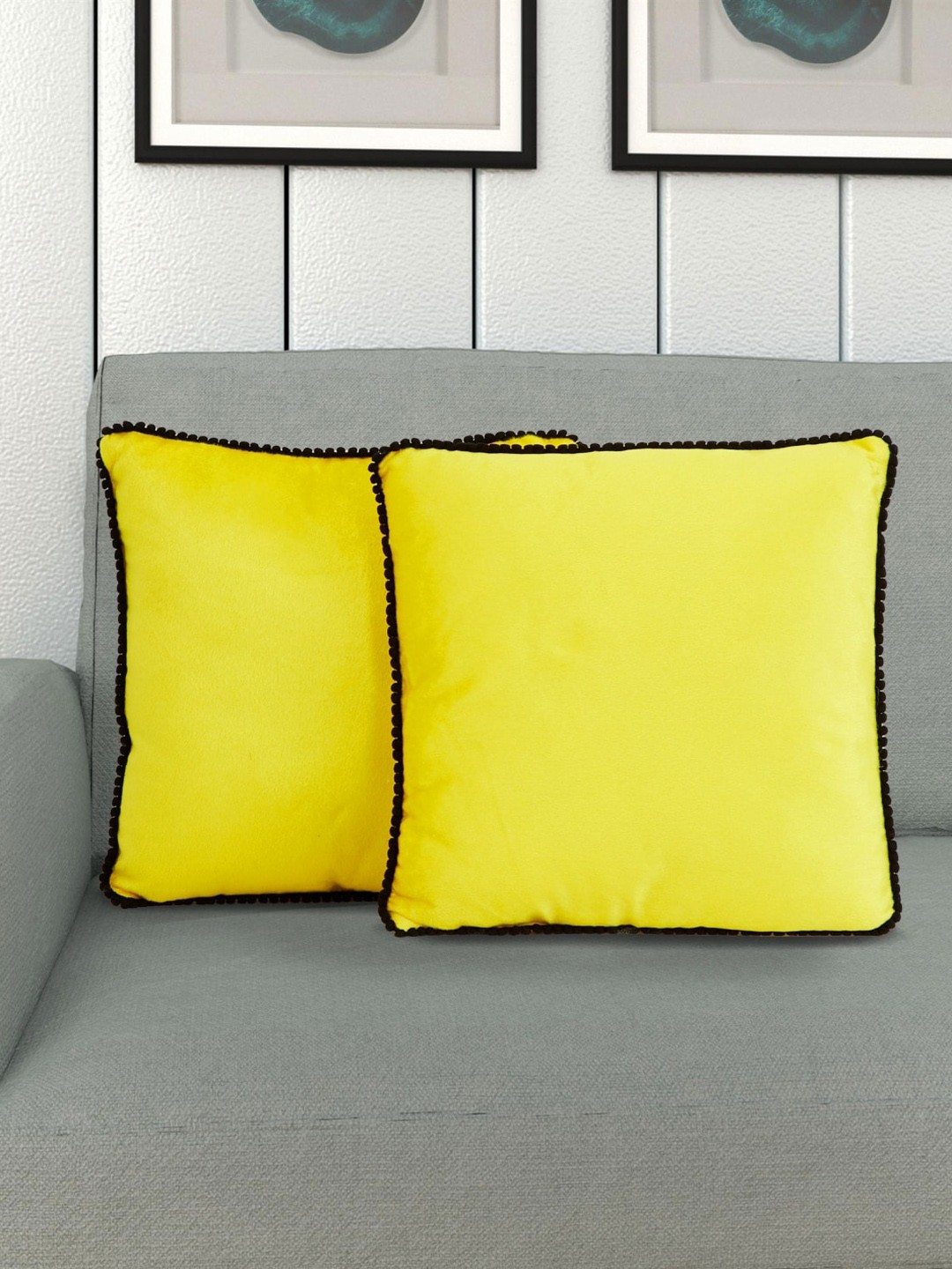 

Home Centre Set Of 2 Yellow & Black Solid Pom-Pom Bordered Filled Cushions