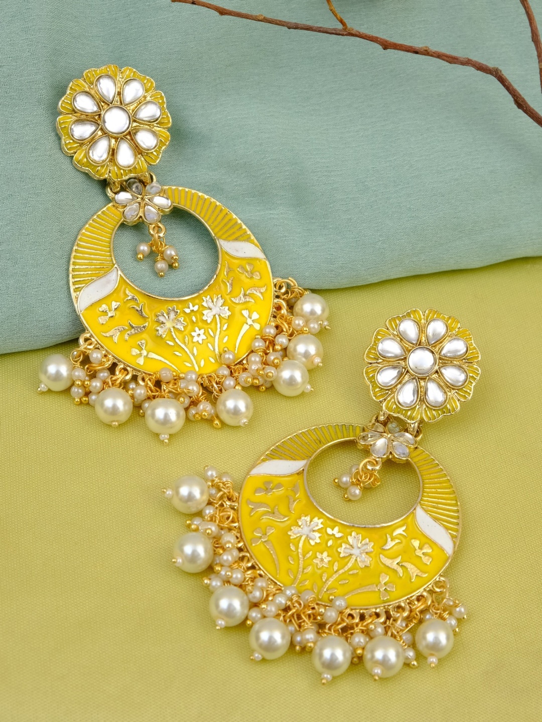 

Crunchy Fashion Gold-Toned & White Circular Chandbalis Earrings