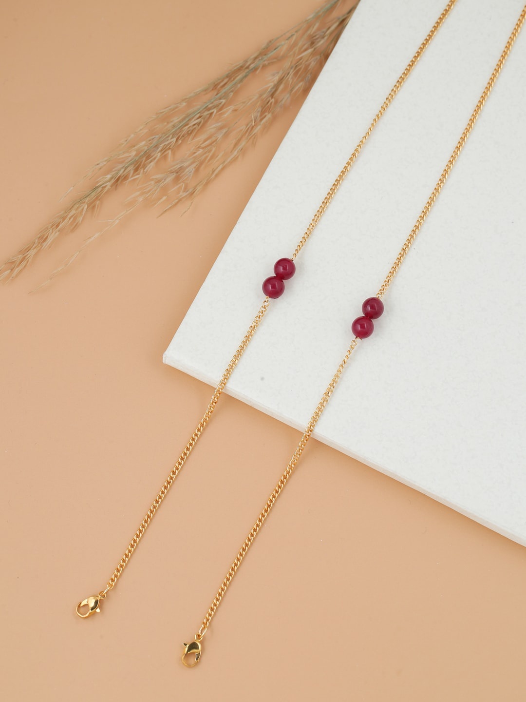 

Shoshaa Gold & Maroon Mask Chain