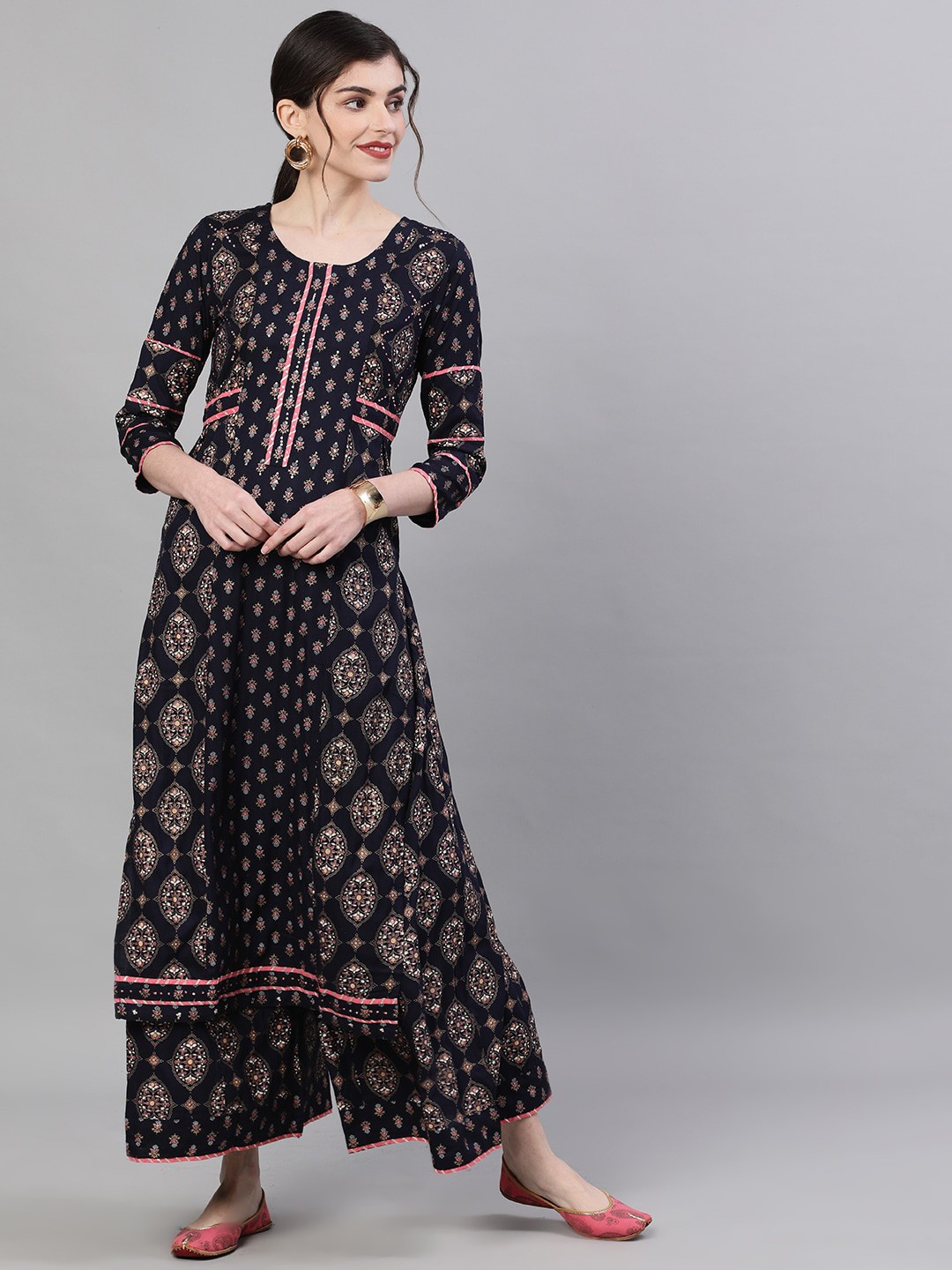 

Ishin Women Navy Blue Ethnic Motifs Printed Kurta with Palazzos