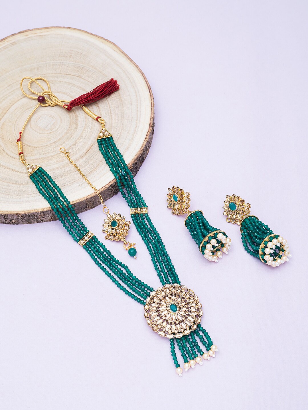 

Golden Peacock Gold-Plated Sea Green & White Kundan-Studded & Beaded Jewellery Set