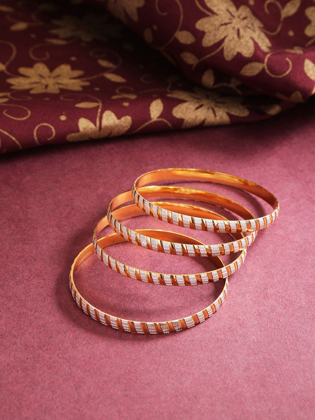 

Priyaasi Set Of 4 Gold-Plated Dual Tone Textured Bangles