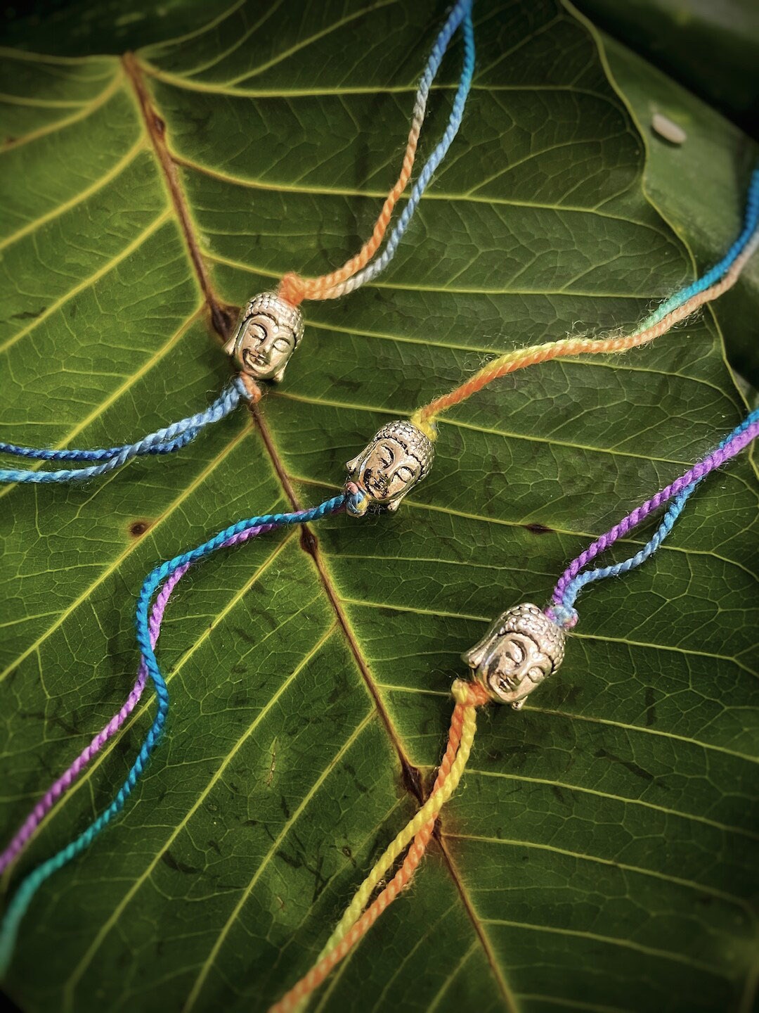 

Digital Dress Room Set Of 3 German Oxidized Silver with Buddha Face Mauli Rakhis