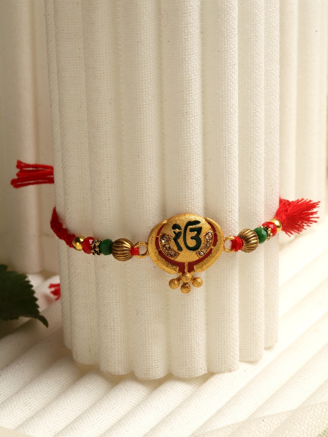 

PANASH Gold-Toned Red Beaded Khanda Rakhi With Roli Chawal