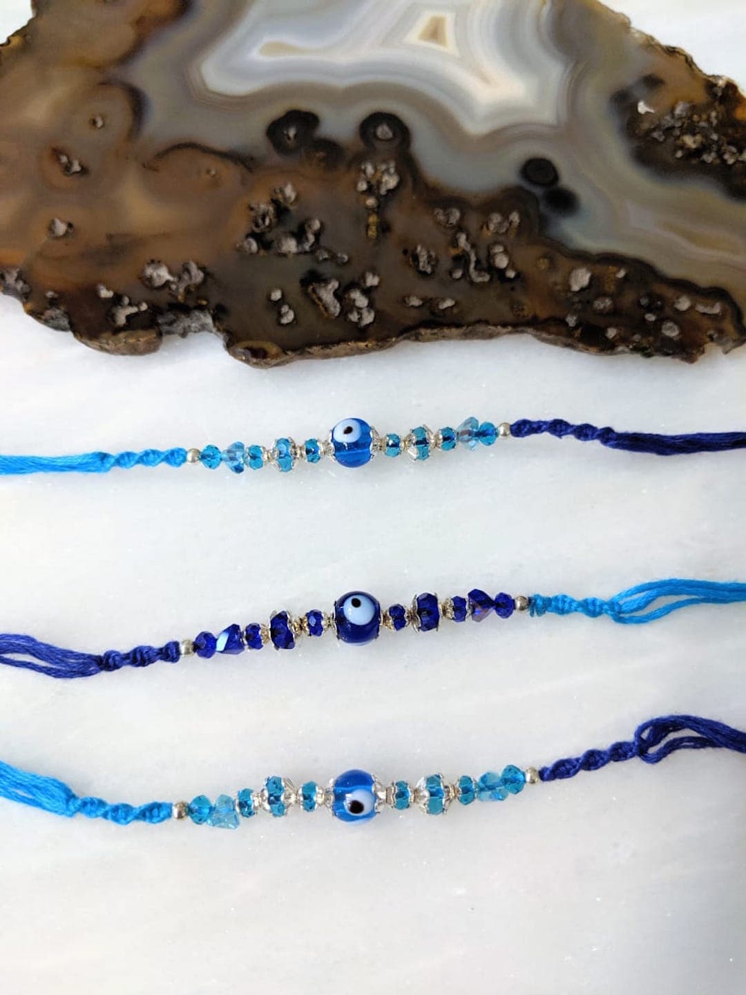 

Digital Dress Room Men Set of 3 Evil Eye Rakhi, White