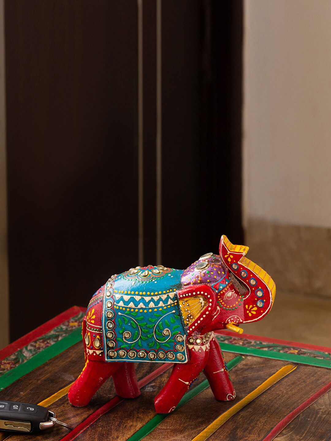 

ExclusiveLane Red & Blue Hand-Painted Wooden Elephant Showpiece